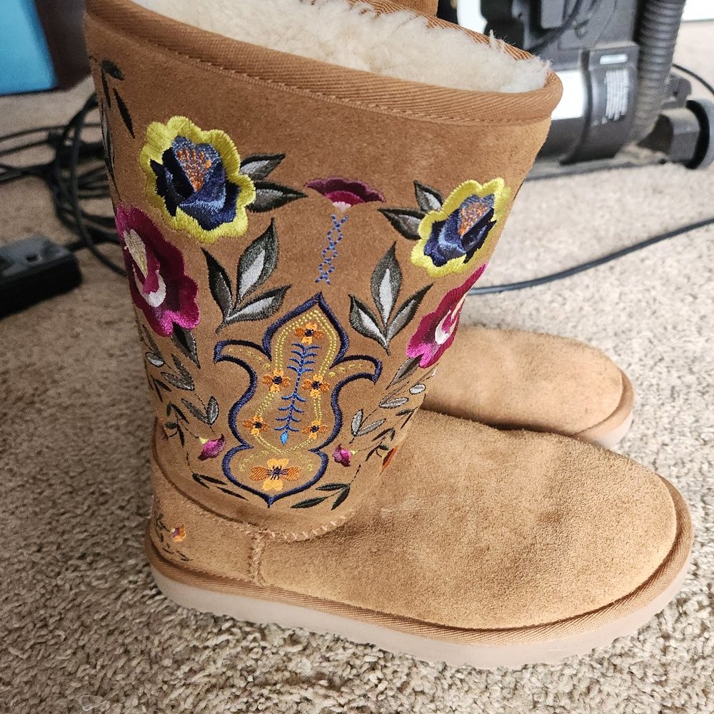 Brown uggs with a floral design.